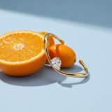 Wavy Pear Cuff — Waterproof Gold-Plated Bracelet styled still life