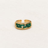 Malachite Bead Ring on pale grey-green linen beside a halved lime and red currants
