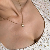 Oval Moonstone Necklace worn at the neckline