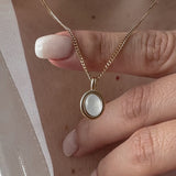 Oval Moonstone Necklace worn at the neckline